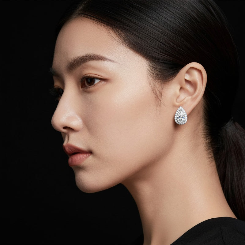Model wearing pear halo stud earrings