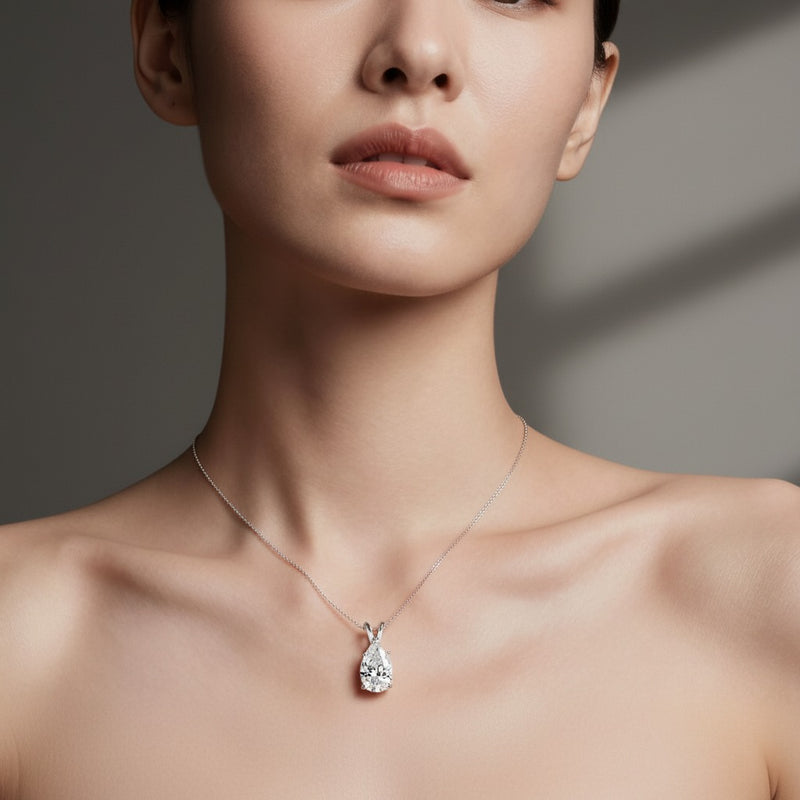 Model wearing pear split bale solitaire pendant