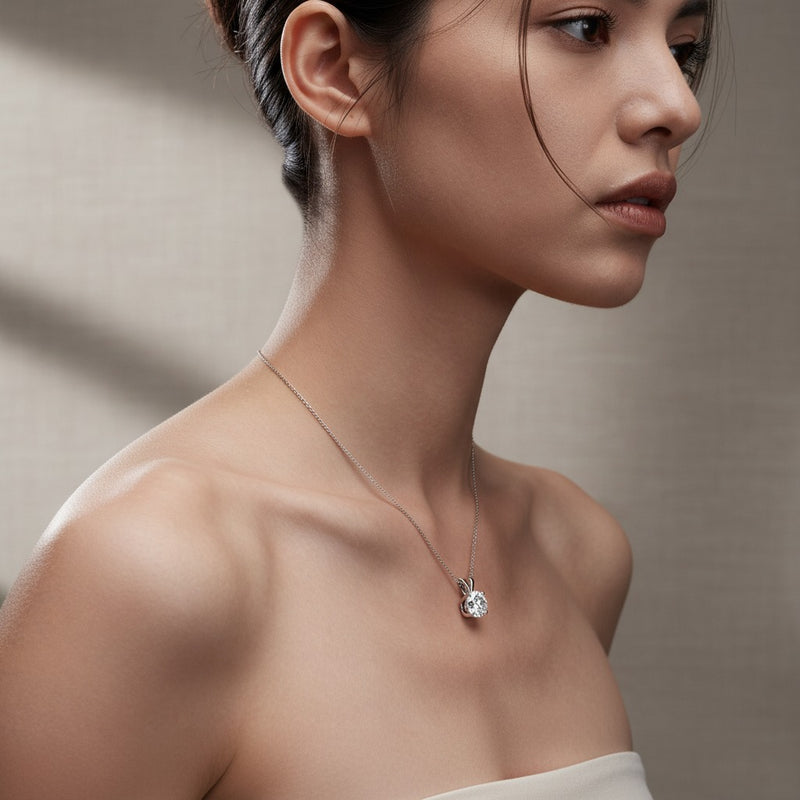 Model wearing round split bale solitaire pendant