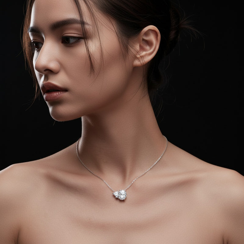 Model wearing pear east west solitaire necklace