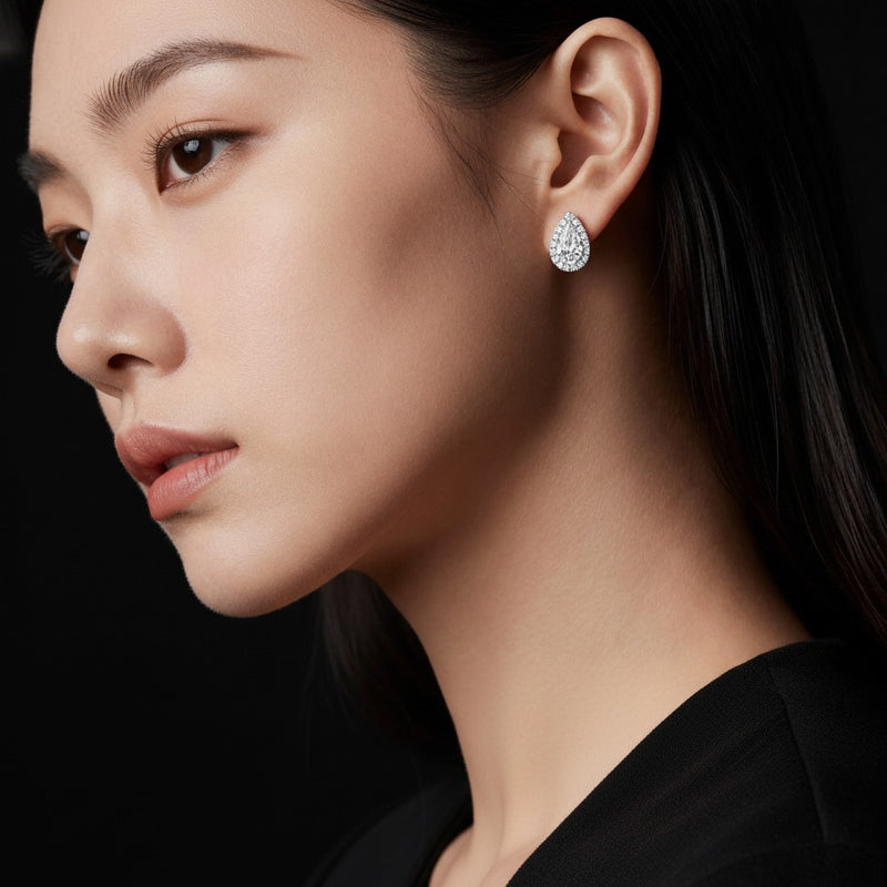 Model wearing pear halo stud earrings