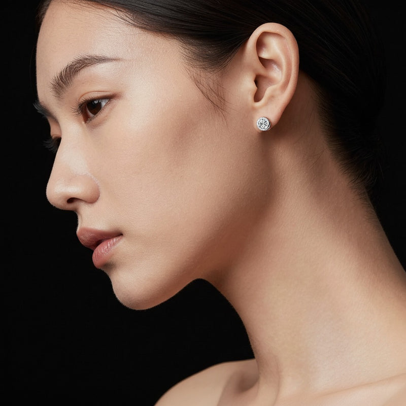 Model wearing round halo stud earrings