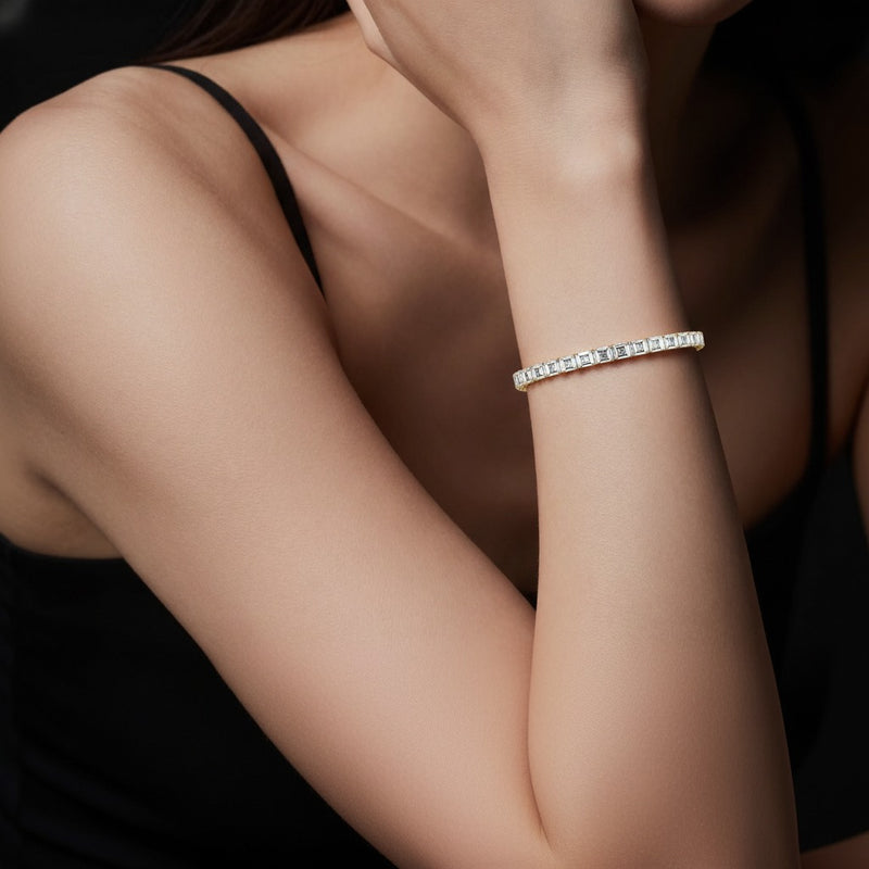 Model wearing emerald tennis bracelet