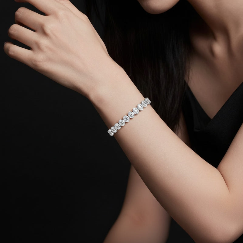 Model wearing oval tennis bracelet