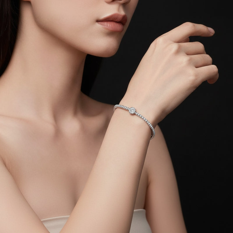Model wearing round graduating tennis bracelet