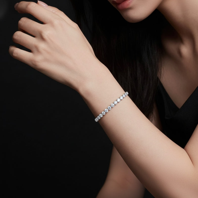 Model wearing oval tennis bracelet