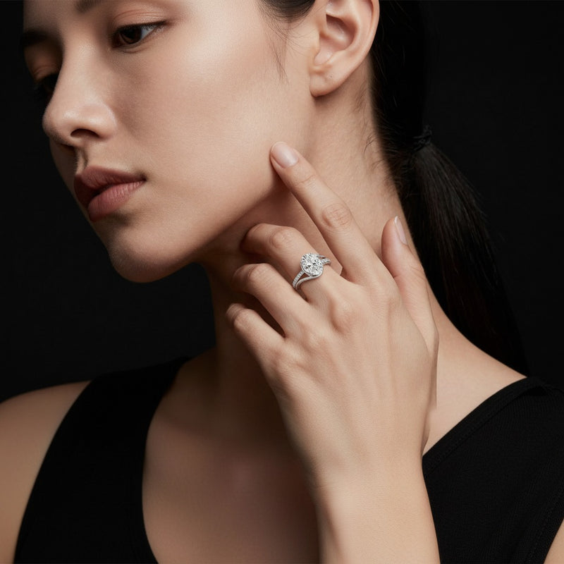 Model wearing oval swirl shank accented engagement ring