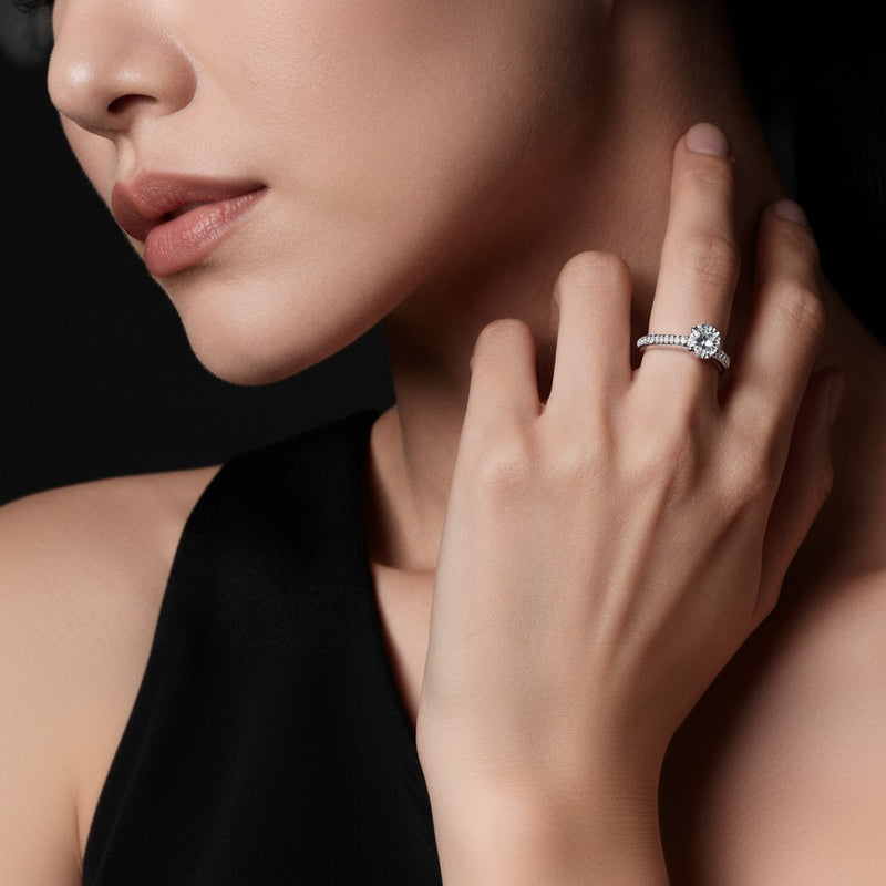 Model wearing oval triple row accented engagement ring