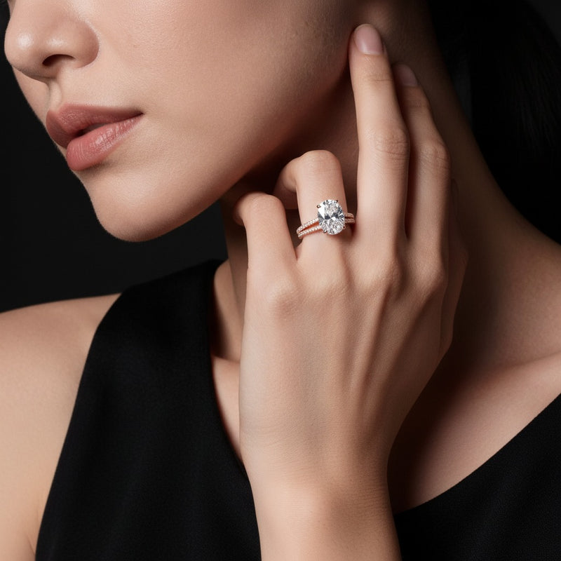 Model wearing pear triple row accented engagement ring