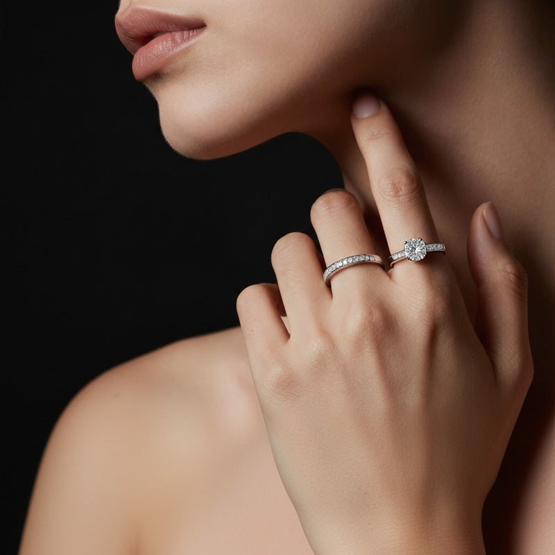 Model wearing emerald plain cathedral trellis shank solitaire engagement ring
