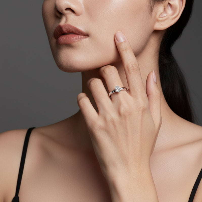 Model wearing pear plain cathedral trellis shank solitaire engagement ring