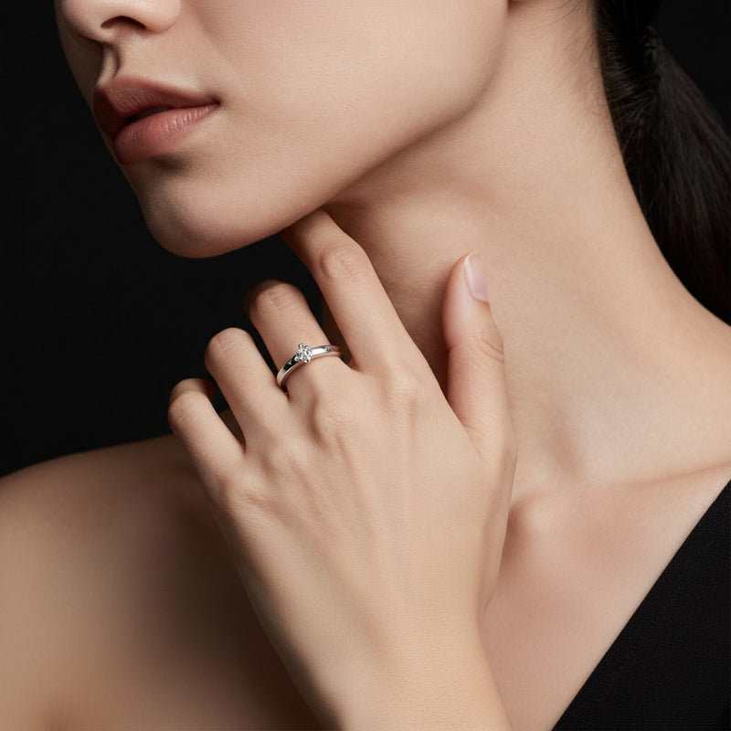Model wearing round plain cathedral trellis shank solitaire engagement ring