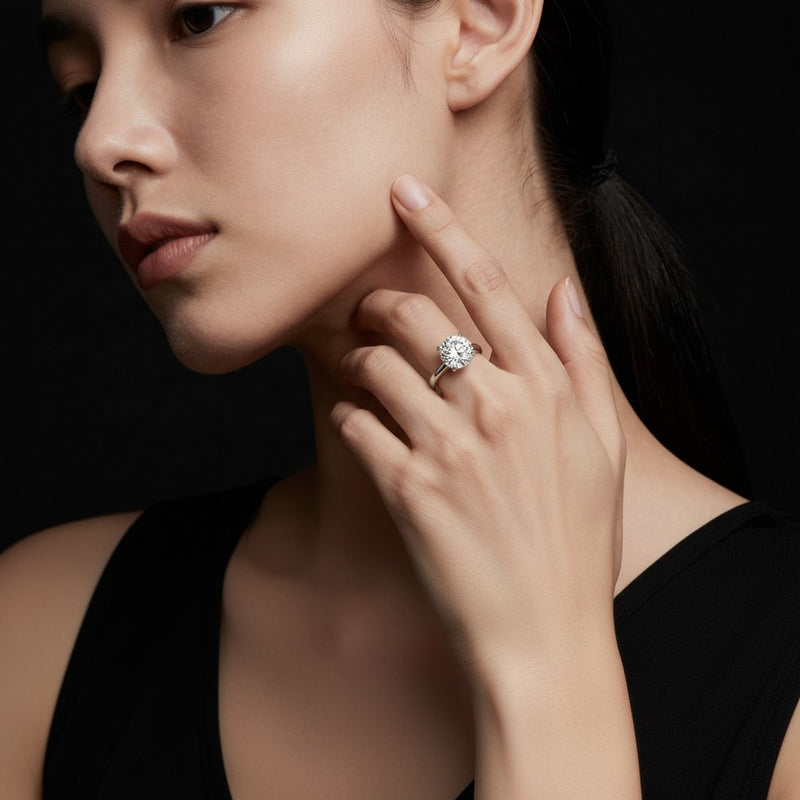 Model wearing round plain cathedral trellis shank solitaire engagement ring
