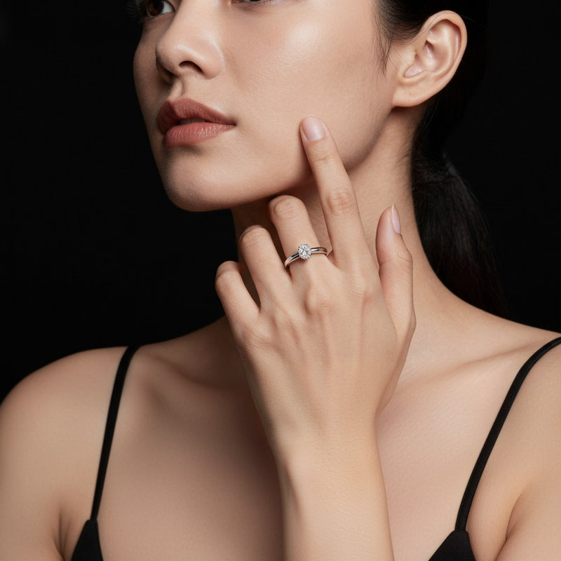 Model wearing marquise hidden halo plain shank engagement ring