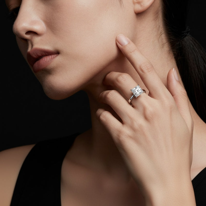 Model wearing princess hidden halo plain shank engagement ring