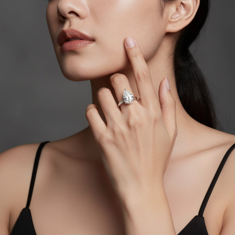 Model wearing pear ring