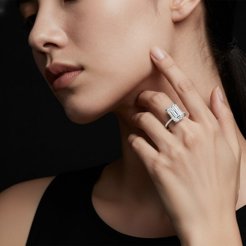 Model wearing radiant hidden halo cathedral shank engagement ring