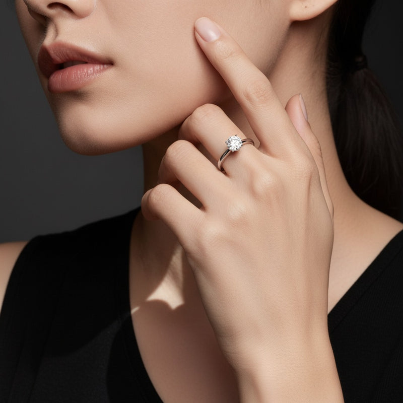 Model wearing round hidden halo cathedral shank engagement ring