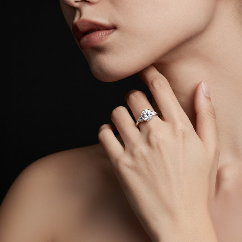 Model wearing round three stone hidden halo ring