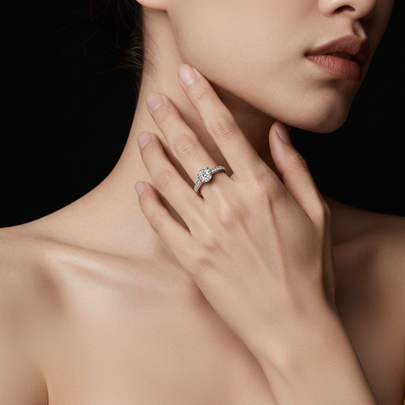 Model wearing emerald split shank trellis engagement ring