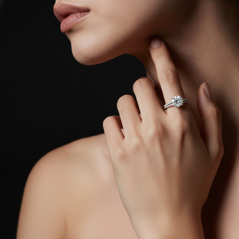 Model wearing round hidden halo accented engagement ring