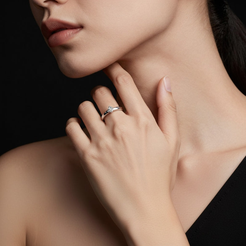 Model wearing round accented enagement ring
