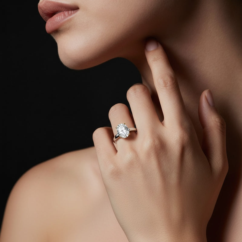 Model wearing oval two tone twisted basket cathedral shank solitaire ring