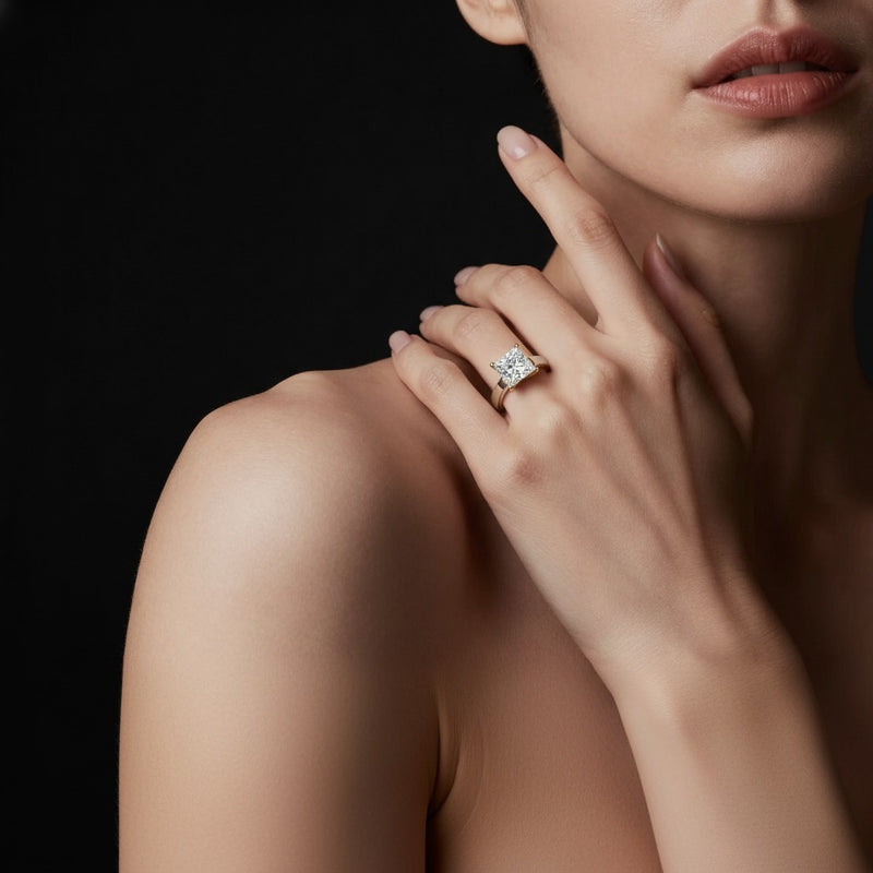 Model wearing princess two tone twisted basket cathedral shank solitaire ring