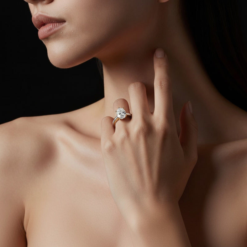 Model wearing pear two tone twisted basket cathedral shank solitaire ring