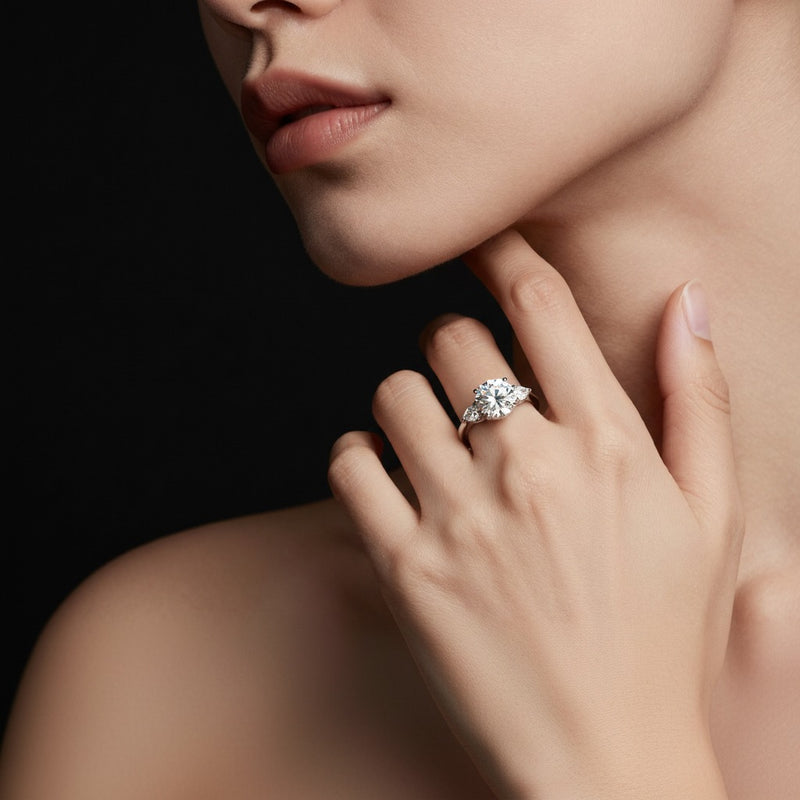 Model wearing round bold accented engagement ring