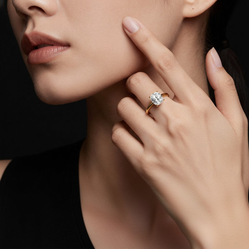 Model wearing cushion knife edge shank solitaire engagement ring