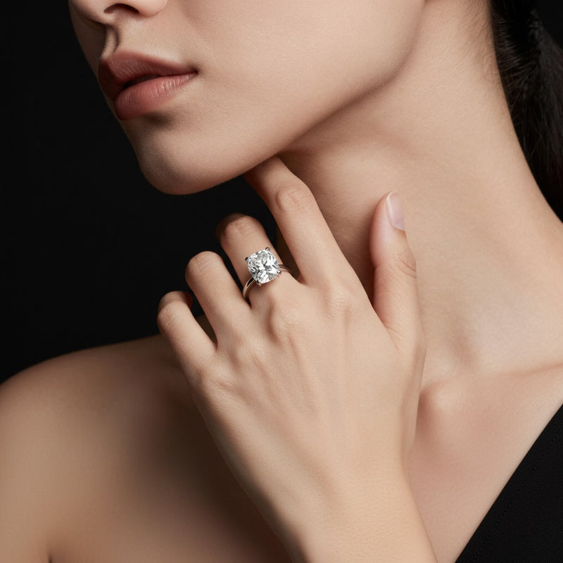 Model wearing cushion knife edge shank solitaire engagement ring