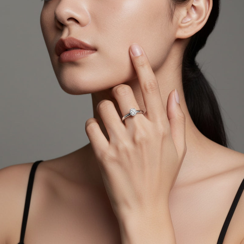 Model wearing round knife edge shank solitaire engagement ring