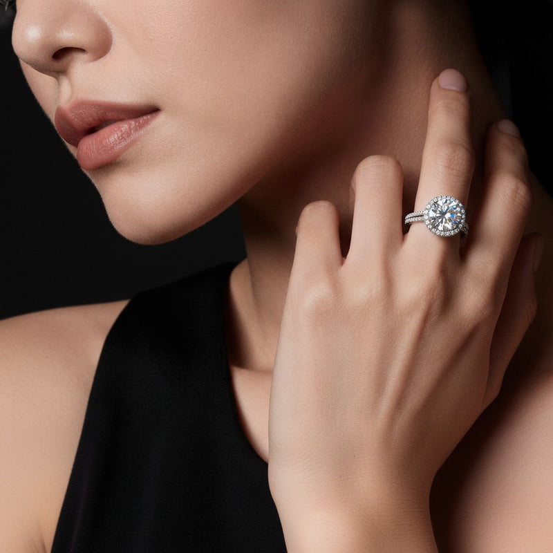 Model wearing round halo accented engagement ring