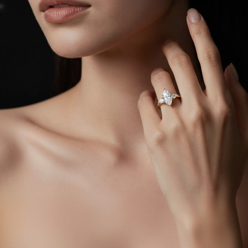 Model wearing marquise three stone accented engagement ring