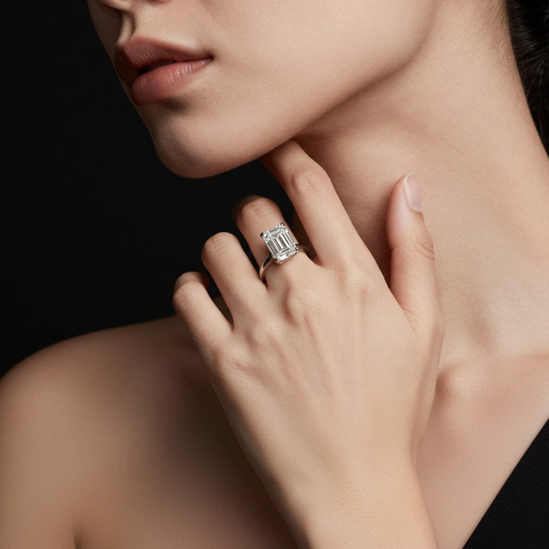Model wearing emerald three row micro pave engagement ring