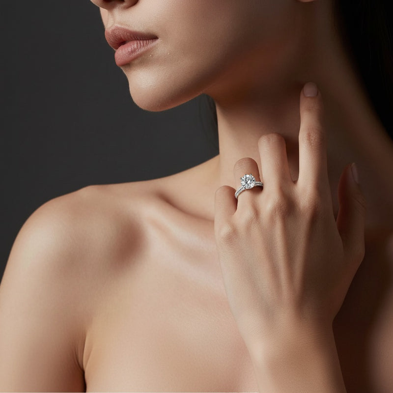 Model wearing round three row micro pave engagement ring