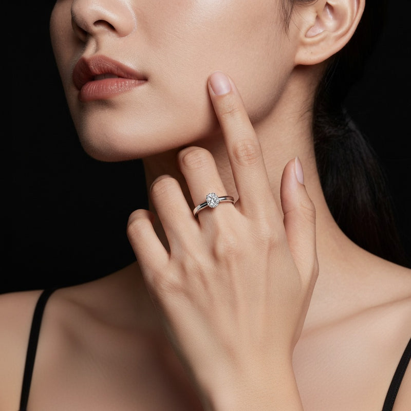 Model wearing oval tulip motif accented engagement ring