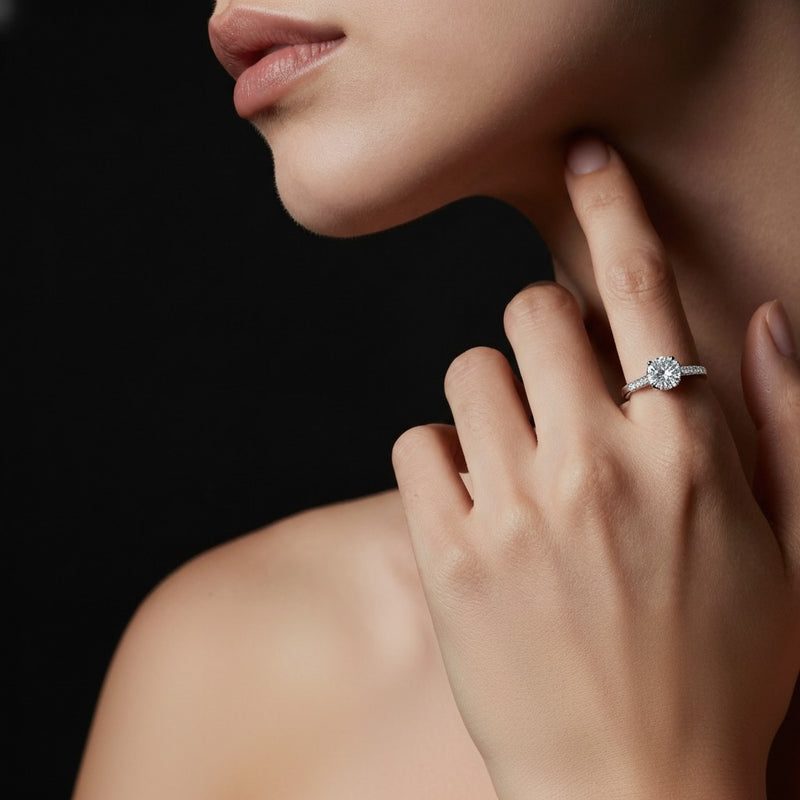 Model wearing round tulip motif accented engagement ring