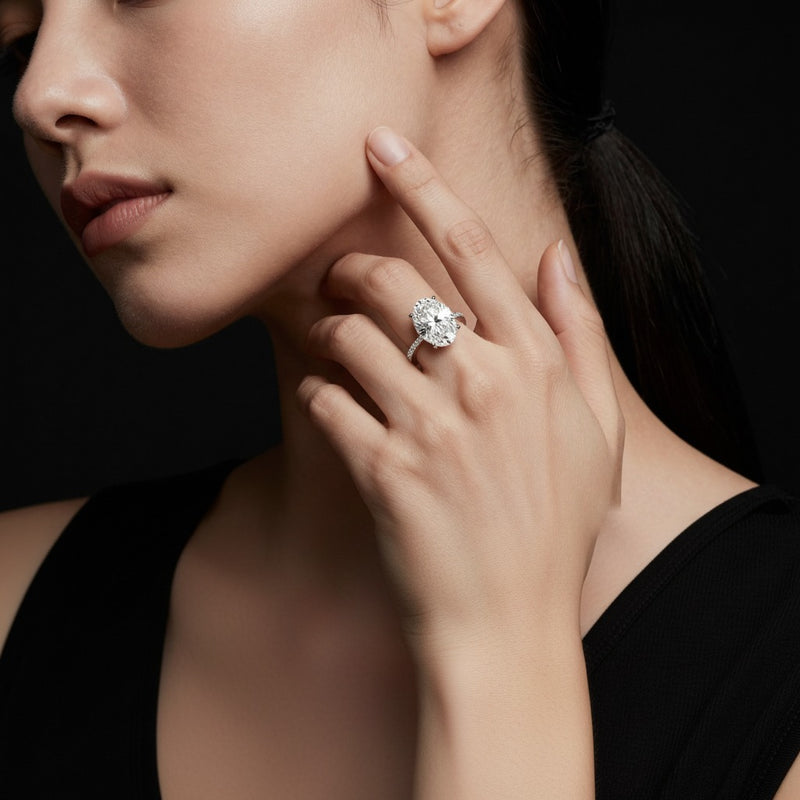 Model wearing oval accented bridge shank engagement ring