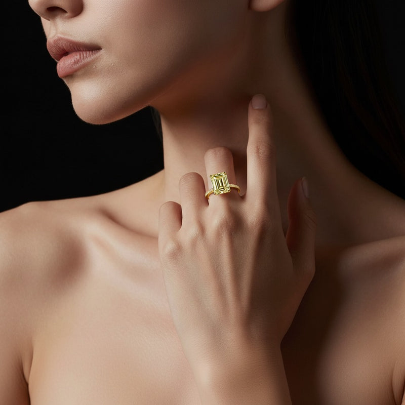 Model wearing radiant accented bridge shank engagement ring