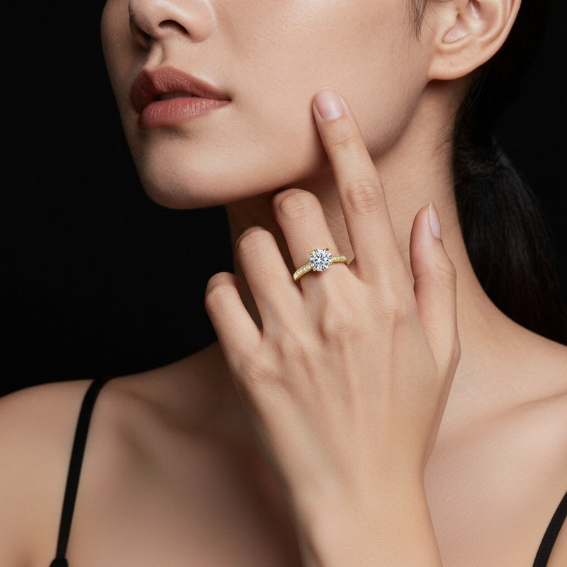Model wearing round accented bridge shank engagement ring