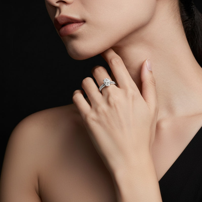 Model wearing oval classic accented set with band and engagement ring