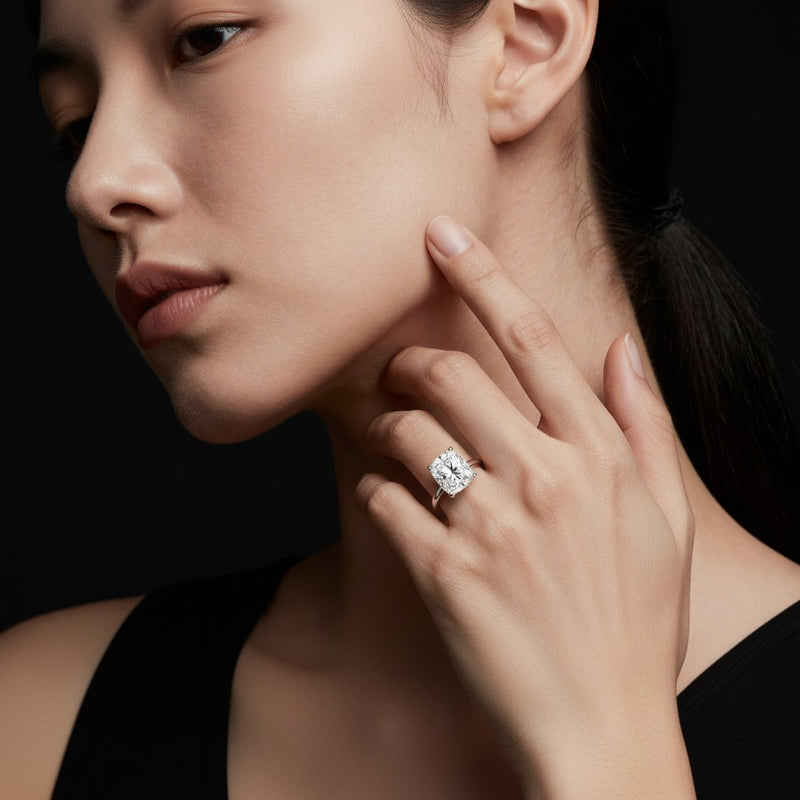 Model wearing cushion classic shank solitaire engagement ring