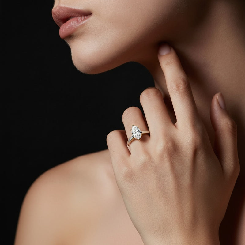 Model wearing marquise two tone six prong engagement ring