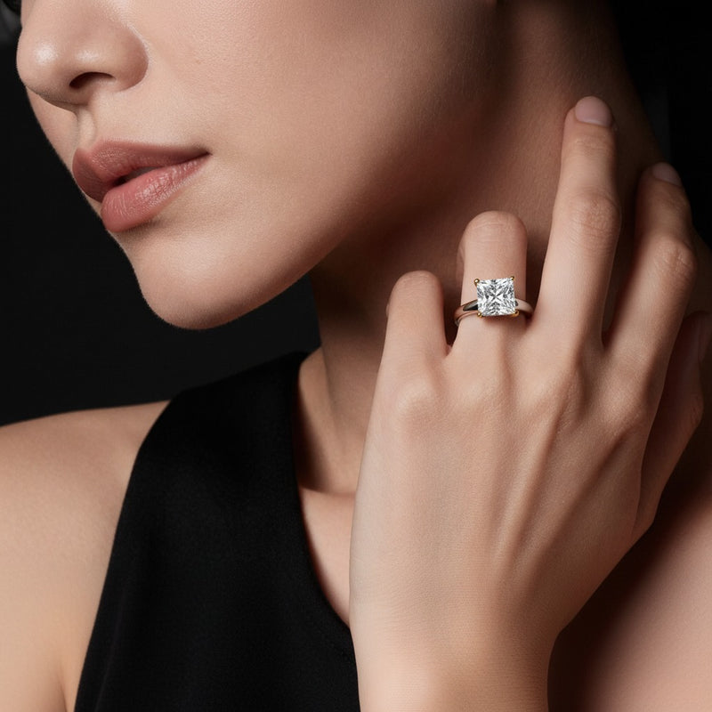 Model wearing princess two tone cathedral shank engagement ring
