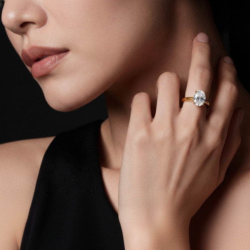 Model wearing pear two tone cathedral shank engagement ring