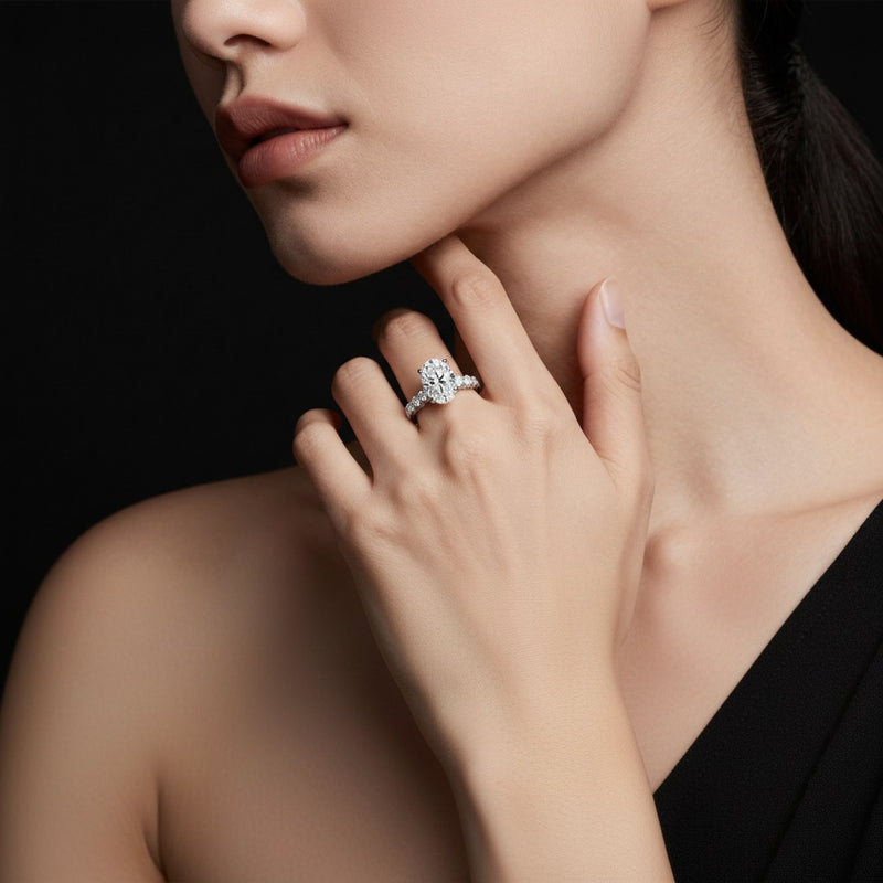 Model wearing oval accented double halo set of band and ring