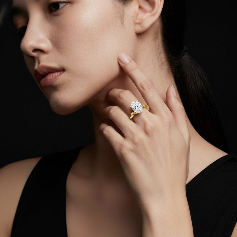 Model wearing oval twisted shank solitaire engagement ring