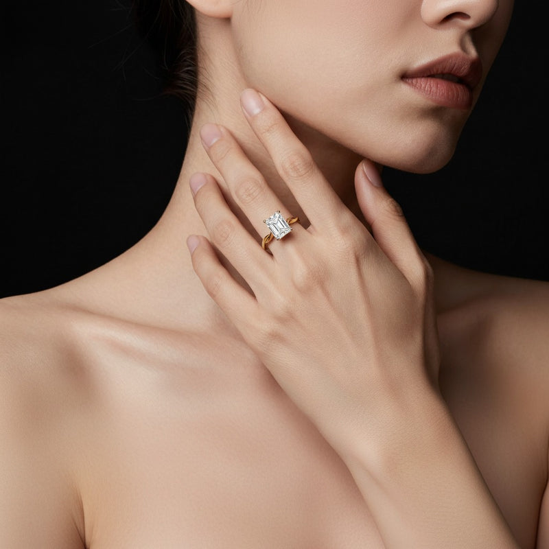 Model wearing radiant twisted shank solitaire engagement ring